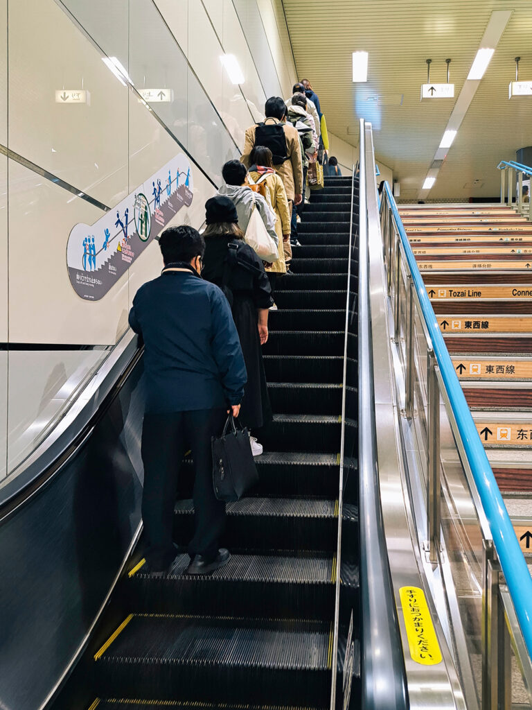 Sapporo, Japan- Jun 3, 2024 : People in line on escalator Subway station Good manners in public Japanese culture