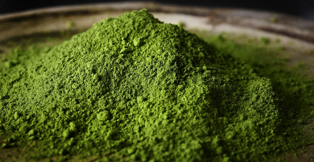 Matcha green tea powder hill close up view